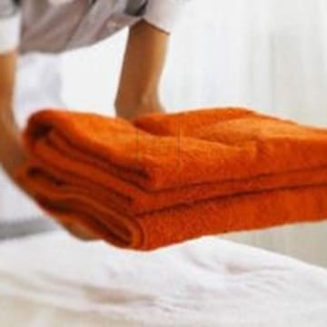 Stacked orange towels for linen services